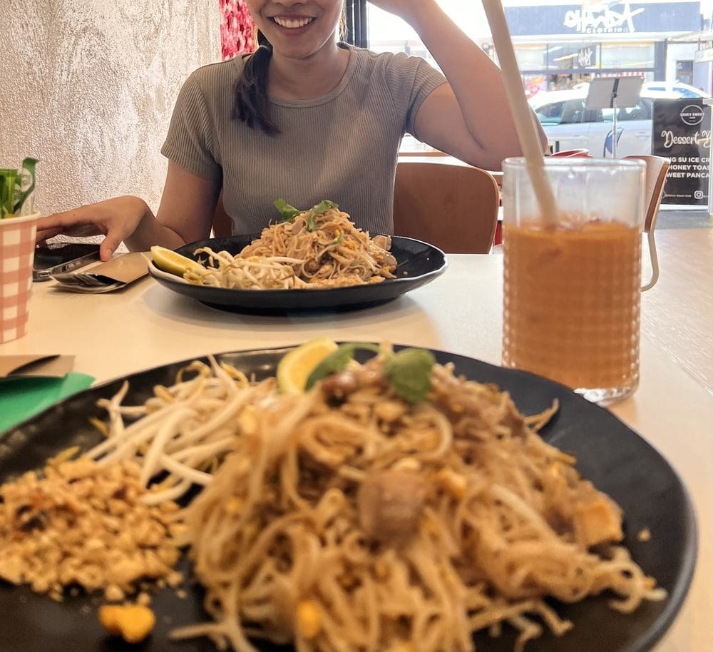 Dining in with Pad Thai and Thai iced tea, Jetty Road visible through the window at Rim Thang Thai, Glenelg