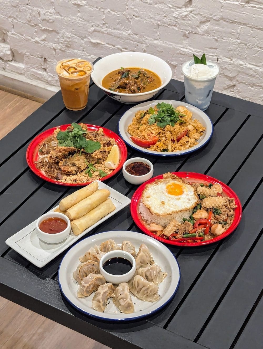 A Thai dinner spread of dumplings, spring rolls, pad krapow and curries at Rim Thang Thai, Glenelg
