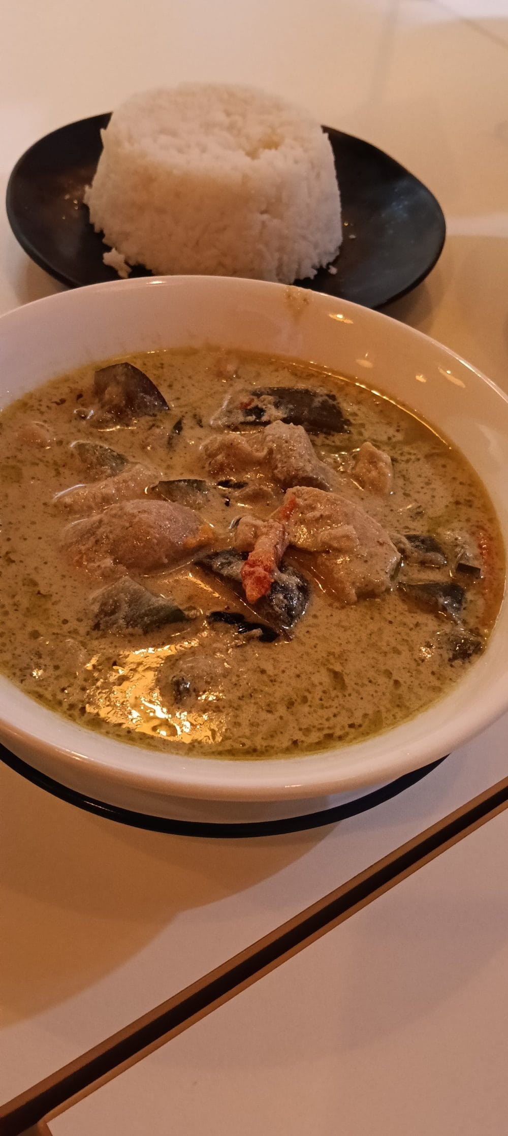 Thai green curry with chicken and eggplant, served with jasmine rice at Rim Thang Thai, Glenelg