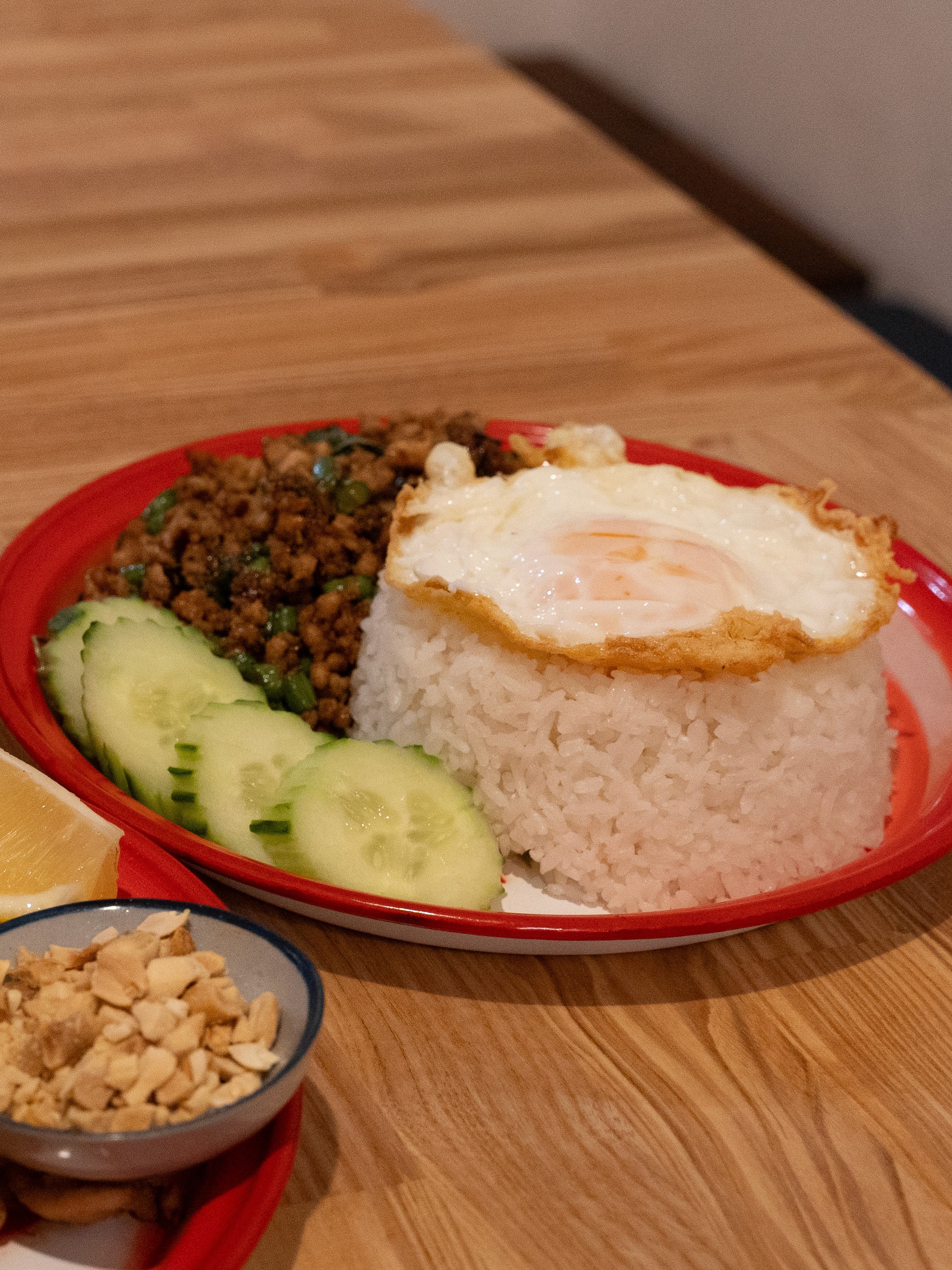 Basil pork stir-fry with rice and a fried egg