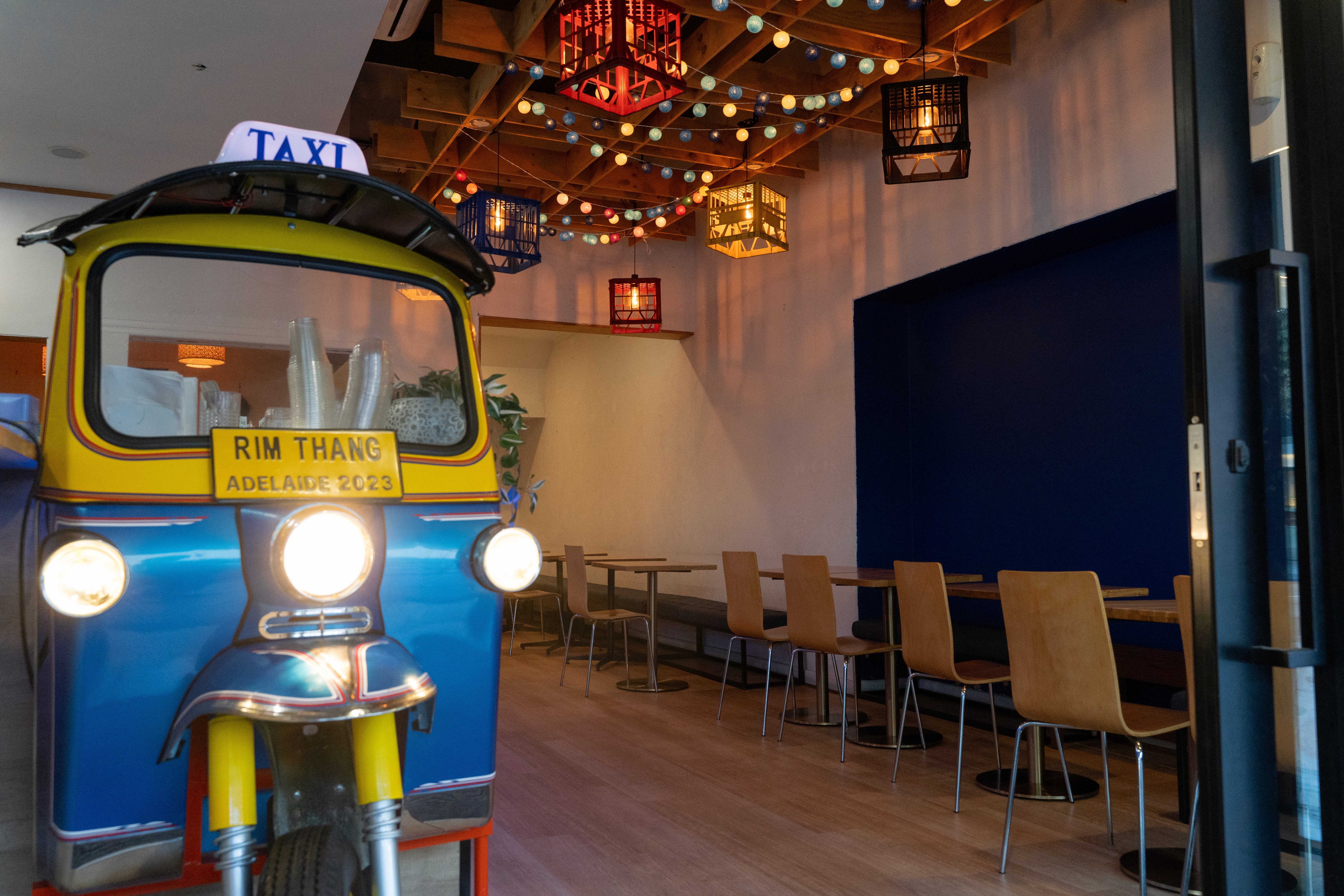 The Rim Thang Thai dining room with its signature tuk-tuk and lanterns